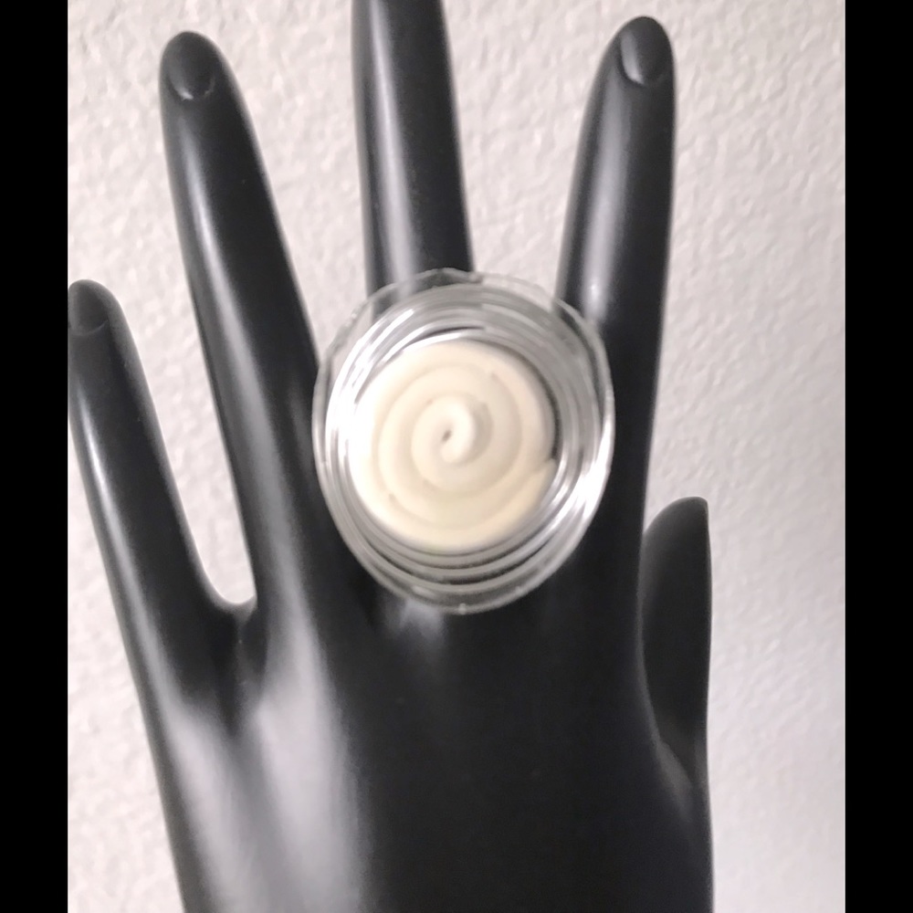 Hand made funky ADJUSTABLE ring.  White polymer clay silver wire soaked in resin